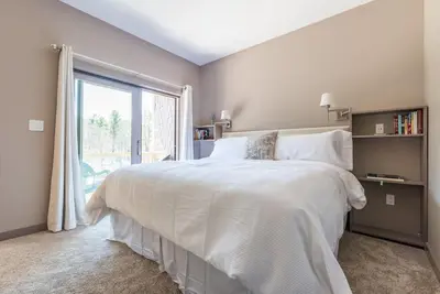 a bedroom with a large white bed and a window at Spencertown Inn in Spencertown