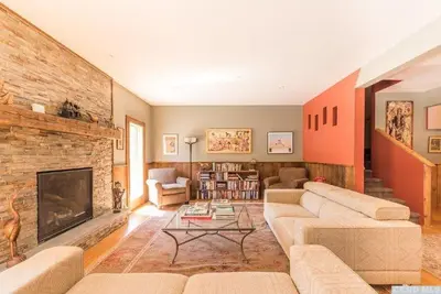 a living room with a couch and a fireplace at Spencertown Inn in Spencertown