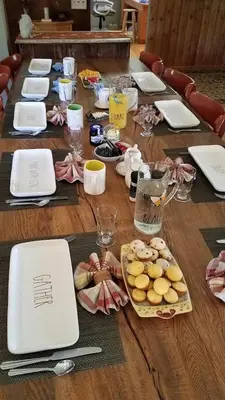 a table with a laptop and food on it at Spencertown Inn in Spencertown