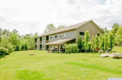 a house with a large yard in front of it at Spencertown Inn in Spencertown