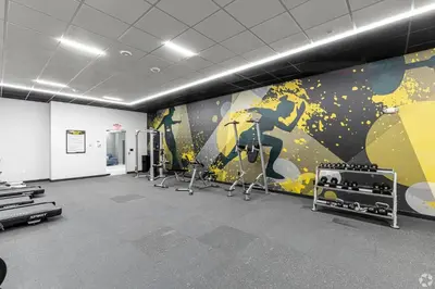 a gym with a mural on the wall at Fully Furnished Studio Wifi GYM Free Parking in Hartford