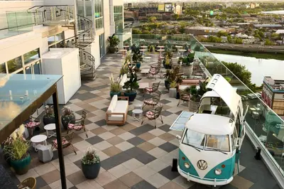 a view of a rooftop patio with a car parked on a building at Renaissance New York Flushing Hotel at Tangram in Queens