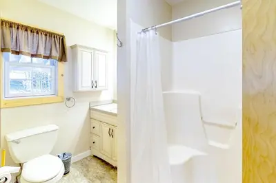 a bathroom with a toilet and a shower at Swaying Pines in Wilmington