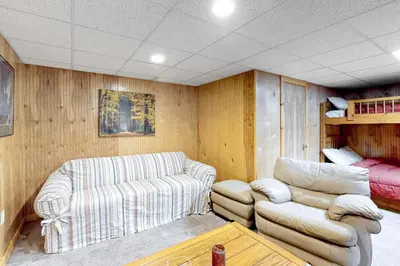 a living room with two chairs and a couch at Swaying Pines in Wilmington