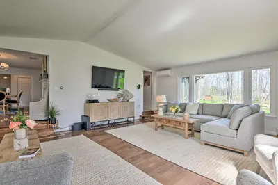 a living room with a couch and a tv at Lovely Highland Home with Pool and Hot Tub! in Highland