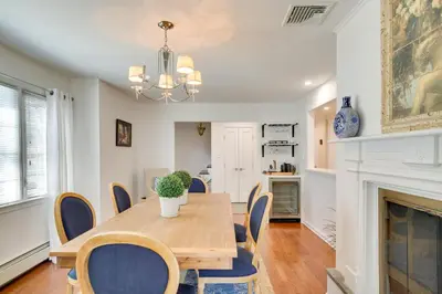 a dining room with a table and chairs and a fireplace at Lovely Highland Home with Pool and Hot Tub! in Highland