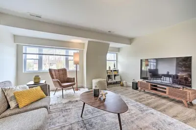 a living room with a couch and a tv at Modern-Chic Athens Home - Fish, Ski and Swim! in Athens