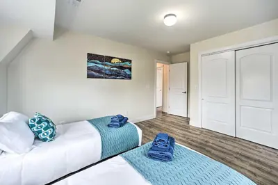 a bedroom with two beds and a closet at Modern-Chic Athens Home - Fish, Ski and Swim! in Athens