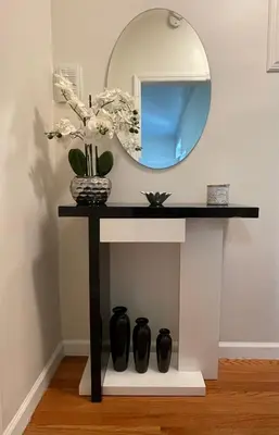 a table with a mirror and vases on it at 1BR Apt in Sunnyside 15 min to Manhattan in Woodside