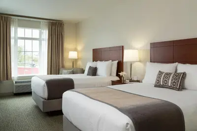 a hotel room with two beds and a window at Hotel Anthracite in Carbondale