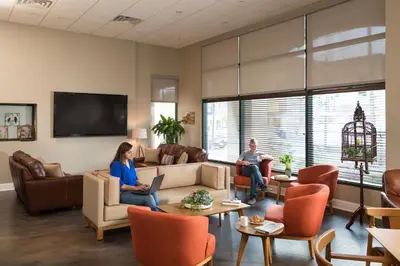 two people sitting in a waiting room at Hotel Anthracite in Carbondale