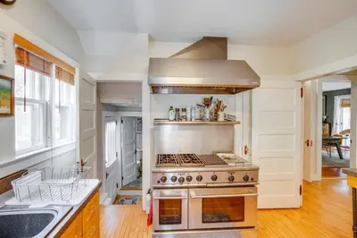 a kitchen with a stove top oven in a room at Elegant Pittsfield Home Near Downtown and Skiing! in Pittsfield
