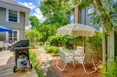a patio with a bbq and a table with a grill at Elegant Pittsfield Home Near Downtown and Skiing! in Pittsfield