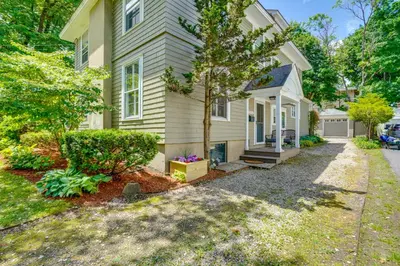 a house with a driveway in front of it at Elegant Pittsfield Home Near Downtown and Skiing! in Pittsfield