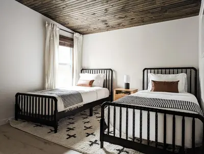 a bedroom with two beds and a window at Pinewood Bungalow - Luxury Cabin, Kid-Friendly in Catskill