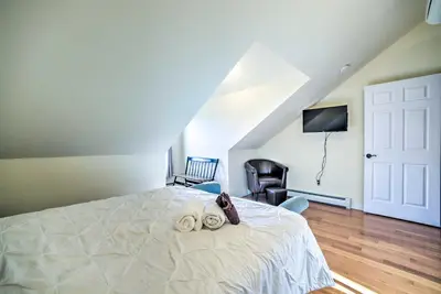 a bedroom with a bed with two towels on it at half Mi to Windham Mtn Main Street Condo in Windham