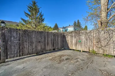 a wooden fence in front of a house at half Mi to Windham Mtn Main Street Condo in Windham