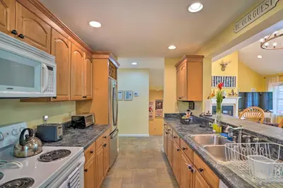 a kitchen with a sink and a stove top oven at Family-Friendly Hancock Home Walk to Slopes! in Hancock