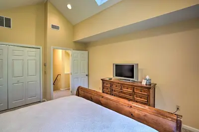 a bedroom with a bed and a tv on a dresser at Family-Friendly Hancock Home Walk to Slopes! in Hancock