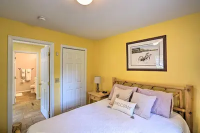 a bedroom with yellow walls and a bed with pillows at Family-Friendly Hancock Home Walk to Slopes! in Hancock