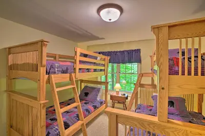 two bunk beds in a room with a bedroom at Family-Friendly Hancock Home Walk to Slopes! in Hancock