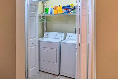 a small laundry room with a washer and dryer at Family-Friendly Hancock Home Walk to Slopes! in Hancock