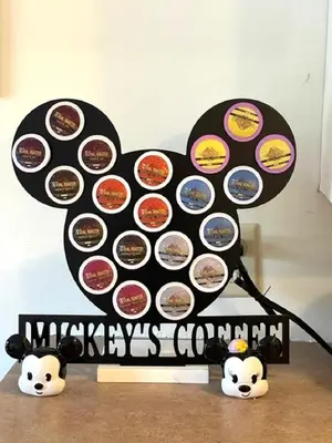a table with a bunch of stickers on it at Disney Magic at Jiminy Mountain in Hancock