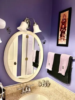 a bathroom with a mirror and a sink at Disney Magic at Jiminy Mountain in Hancock