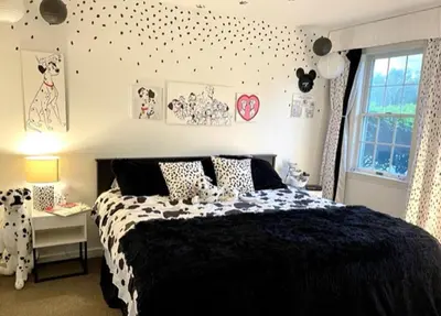 a bedroom with a black and white bed and a desk at Disney Magic at Jiminy Mountain in Hancock
