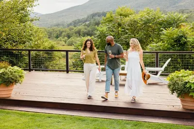 a group of three people walking on a wooden deck at Hill Farm Inn - Manchester in Sunderland
