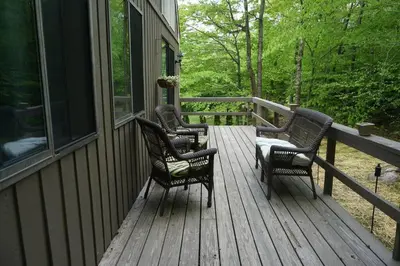 three rocking chairs sitting on a porch of a house at 4BD 2BA - Mount Snow VT - Ski-Back Trail - Shuttle in Dover