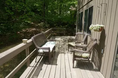 two chairs and a table on a porch at 4BD 2BA - Mount Snow VT - Ski-Back Trail - Shuttle in Dover
