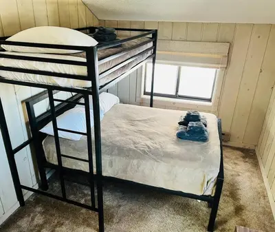 a room with two bunk beds in a room at 4BD 2BA - Mount Snow VT - Ski-Back Trail - Shuttle in Dover