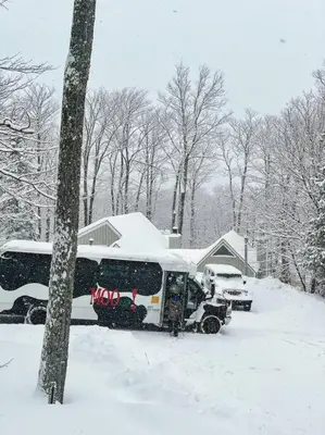 a bus parked in a yard covered in snow at 4BD 2BA - Mount Snow VT - Ski-Back Trail - Shuttle in Dover