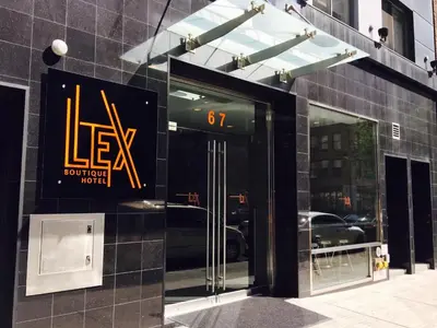 a store front with a sign on the side of a building at Lex Hotel NYC in New York