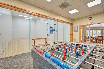 a gym with a row of water tanks in a room at Timber Creek Townhome with 2 Decks and Mtn Views! in West Dover
