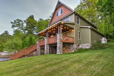 an image of a house with a wrap around porch at Large Yard and Games Edgewater Escape in Paupack! in Paupack