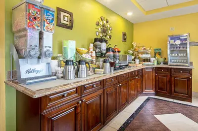 a kitchen with a counter with aasteryasteryasteryasteryasteryasteryasteryasteryastery at Quality Inn & Suites Glenmont - Albany South in Glenmont