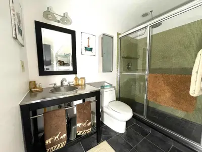 a bathroom with a toilet and a sink and a shower at Gorgeous Ski On/Off 2 BR Sleeps 8 Jiminy-Must See Luxury in Hancock