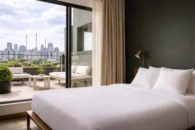 a bedroom with a large bed and a large window at Dutch Hotel Long Island City New York , Belvilla District 6 Formerly Sonder in Long Island City