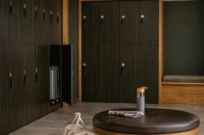 a locker room with lockers and a table in front at Dutch Hotel Long Island City New York , Belvilla District 6 Formerly Sonder in Long Island City