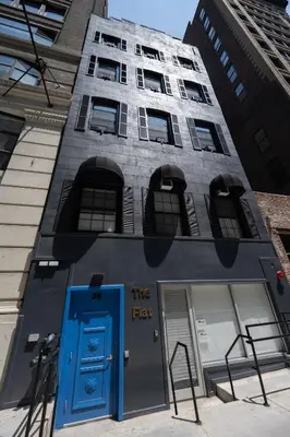 a building with a blue door in front of it at The Flat NYC in New York