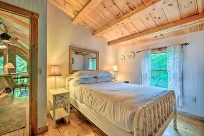 a bedroom with a large bed in a room at Game Room and Hot Tub Pet-Friendly Mount Snow Gem in Dover