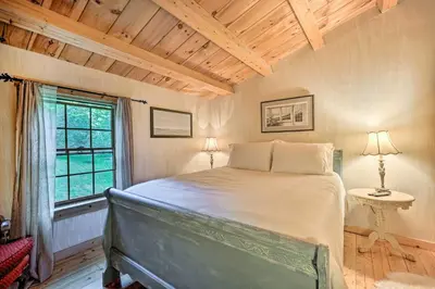 a bedroom with a bed in a room with a window at Game Room and Hot Tub Pet-Friendly Mount Snow Gem in Dover