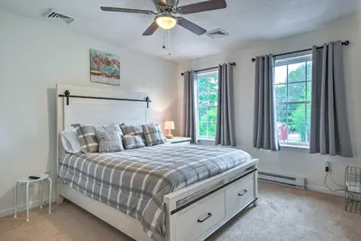 a bedroom with a bed and a ceiling fan at Jacuzzi and Resort Amenities Tobyhanna Family Home! in Tobyhanna