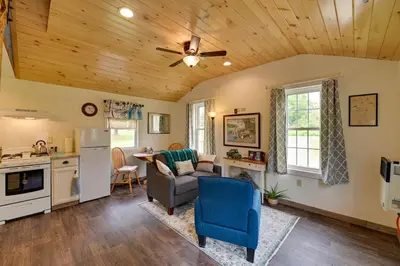 a kitchen and living room with a ceiling fan at Quiet Country Escape Fire Pit, Fish On-Site! in Leonardsville