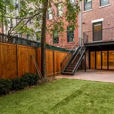 a house with a wooden fence and a staircase at Spectacular vacation home with excellent location in New York in New York