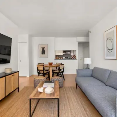 a living room with a couch and a table at Family Apartment in Excellent Sector of New York in New York