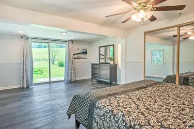 a bedroom with a bed and a ceiling fan at River Views and Covered Deck Susquehanna Home! in Susquehanna