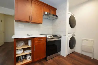 a small kitchen with a stove and a refrigerator at ADA-accessible, newly remodeled 3-BR/2-Bath Home in Tobyhanna